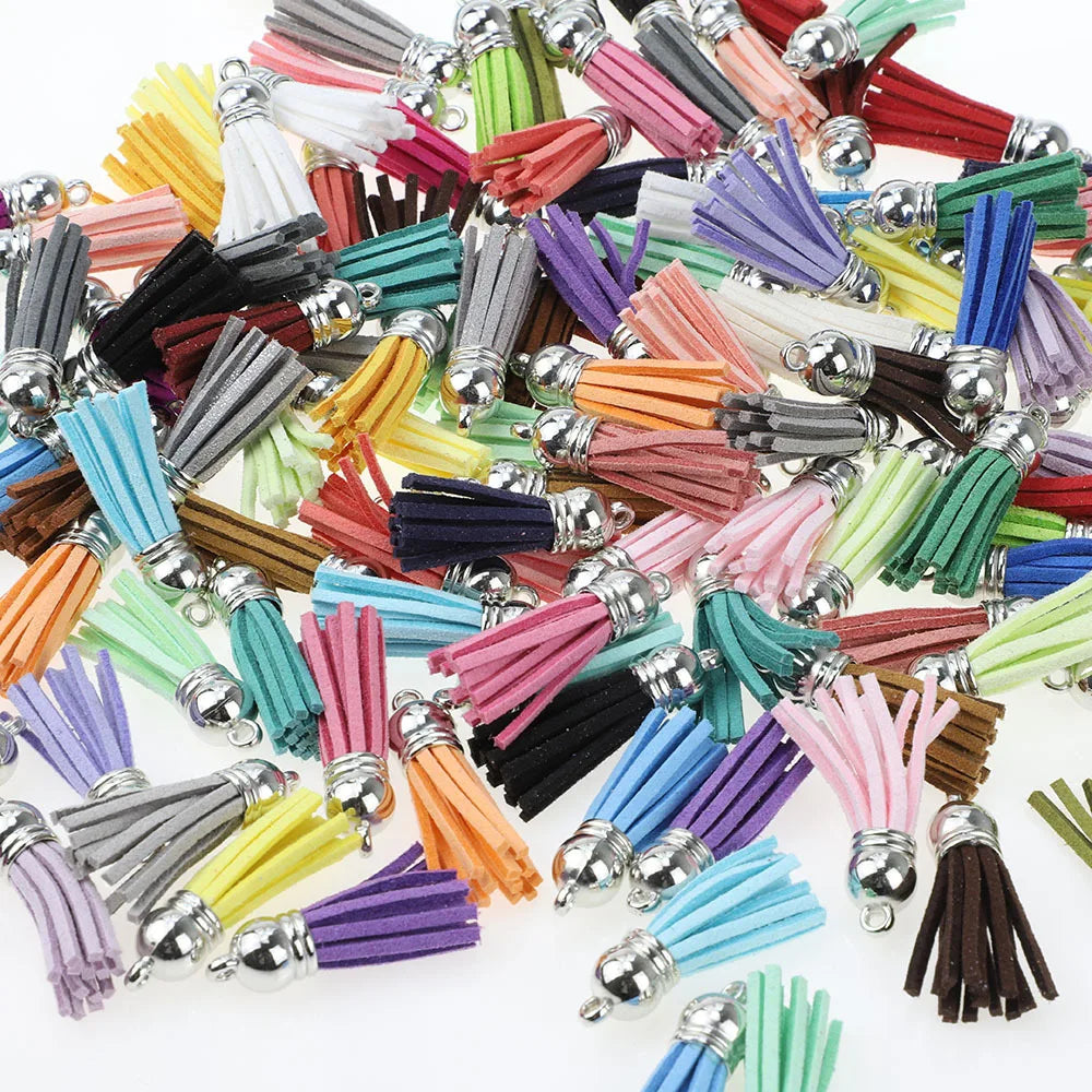 A collection of mixed color velvet tassels in various shades including pink, purple, green, yellow, and brown.