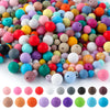 A large pile of colorful soft silicone round beads in various shades including pink, yellow, blue, and green.