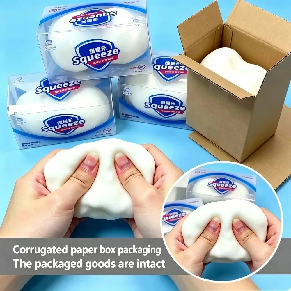 Hands are holding a white squishy stress ball product packaged in cardboard boxes.
