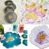 A collection of crushed glass in various colors and textures including gray, yellow, pink, and blue for resin and jewelry mak