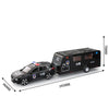Black diecast metal RV camper truck model with sound and light features