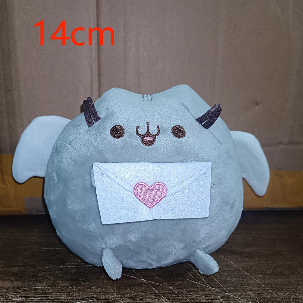 A light blue plush cat doll with horns and a heart-shaped envelope on its chest.