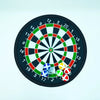A black dartboard with a target design and several colored sticky balls placed on the board.