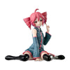 A pink-haired anime figure of Hatsune Miku in a teal jacket and shorts posing with a finger raised.