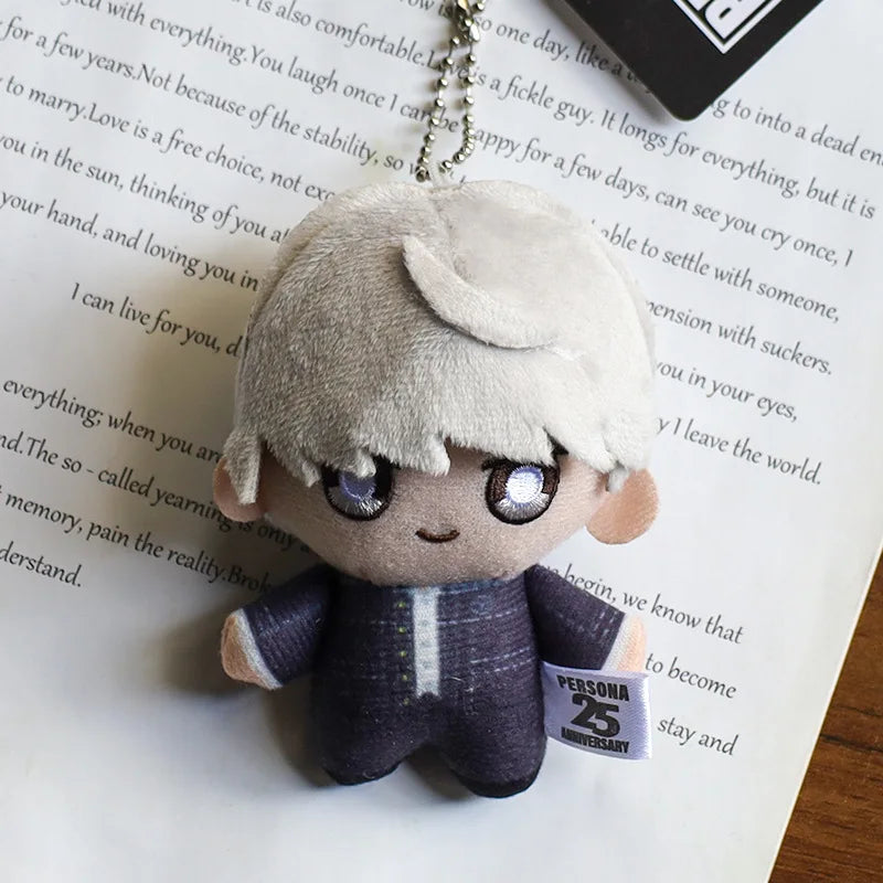 A small, light gray anime character plushie pendant charm with purple eyes and short white hair.