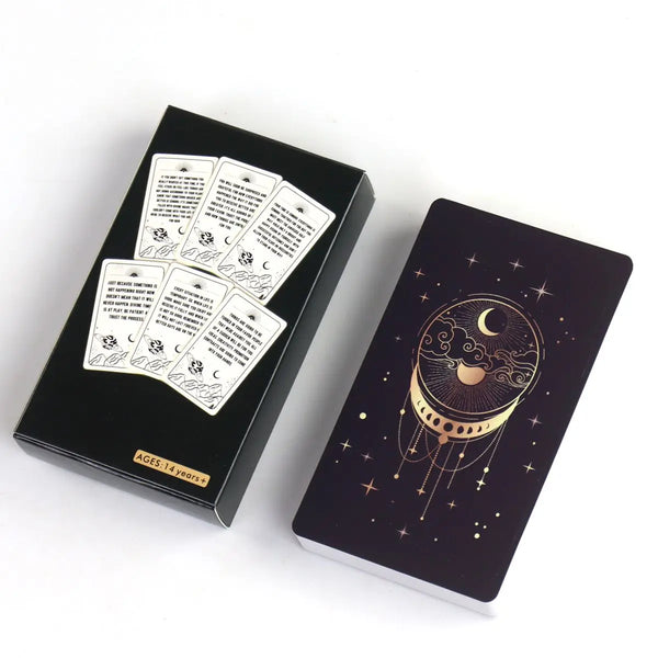 A black box and a card featuring a celestial design for an Intuitive Guidance Deck for Clarity.