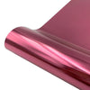 A close-up view of a roll of metallic pink glitter holographic heat transfer vinyl.