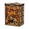 A wooden model kit of a fossil museum book nook featuring detailed dioramas and an interior display.