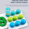 A collection of nine solid wood water-colored lacquer beads in various shades of blue and green on a white surface.