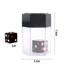 A clear plastic container holding black and white exploding dice cubes with a black lid.