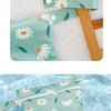 A teal floral waterproof wet and dry bag set featuring daisy and leaf patterns.