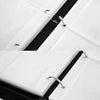 Close-up of a white PU leather card binder with a black zipper and silver metal hardware.