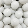 A close-up view of a large quantity of white play balls for ball pits and games.