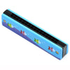 A blue wooden harmonica with a black grille featuring cartoon fish designs.