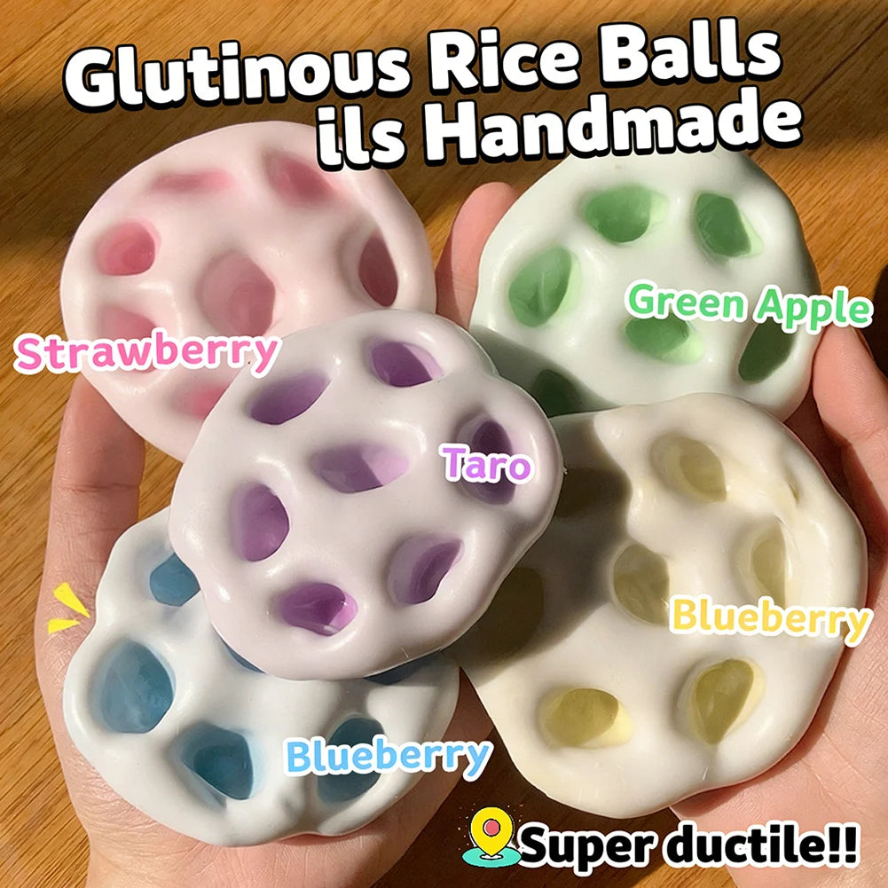 Handmade glutinous rice balls in various fruit flavors including strawberry, taro, blueberry, and green apple