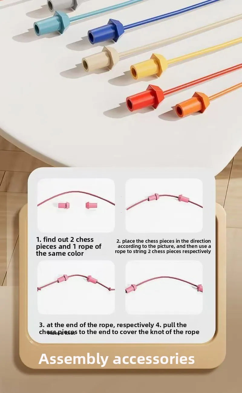 Assortment of colored rope and wooden connectors used for a puzzle or challenge toy assembly.