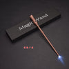 A brown LED light-up magic wand is displayed diagonally across a dark box with the text Magic Wand printed on it.
