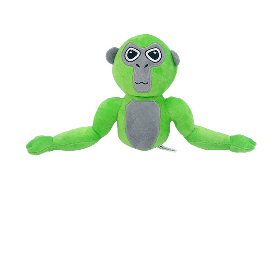 A soft green and gray plush toy of a monke gorilla with large eyes.