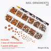 A box of rhinestone nail ornaments, including a point drill pen and various glass gems for nail art.