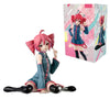 A pink Hatsune Miku PVC figure in a blue outfit is displayed next to its packaging box.