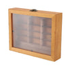 A wooden shelf with a glass front displaying small wooden blocks for anxiety relief or fidgeting.