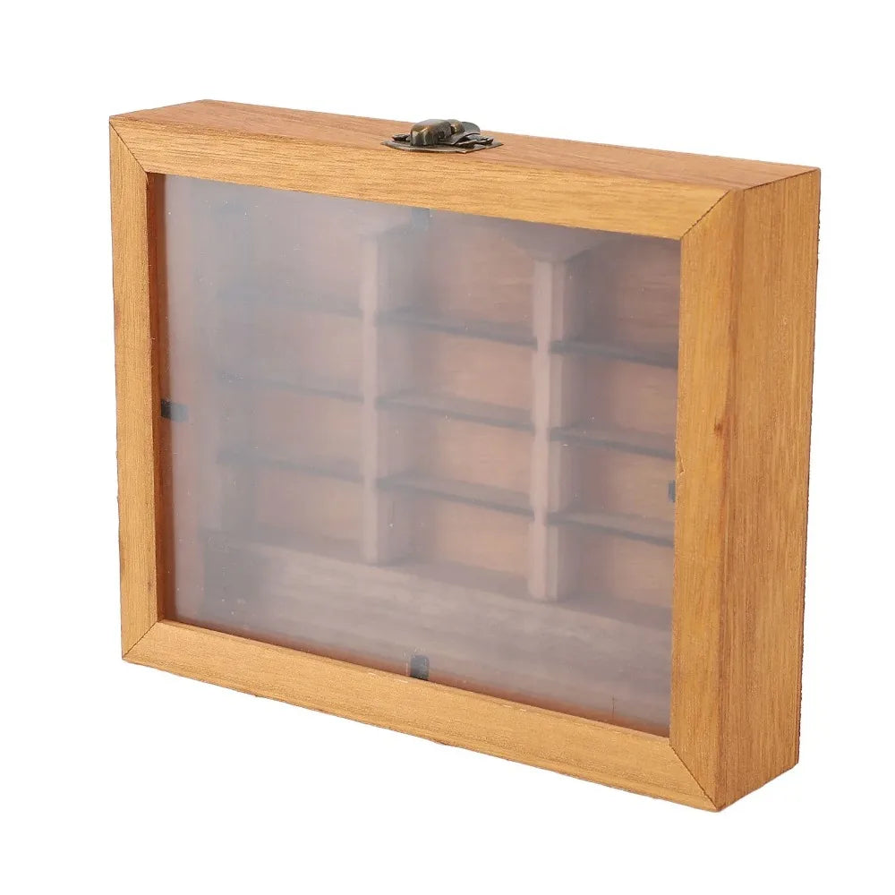A wooden shelf with a glass front displaying small wooden blocks for anxiety relief or fidgeting.