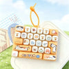 A set of 26 cartoon animal keycap keychains arranged in a grid on a white surface with an orange charm.