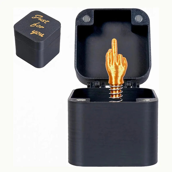 A dark blue pop-up gift box with a gold middle finger hand design.
