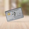 A Mexican Express style card featuring a man's portrait and contact number on a silver background.