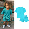 A turquoise kids' summer tracksuit set featuring a short sleeve top and matching shorts.