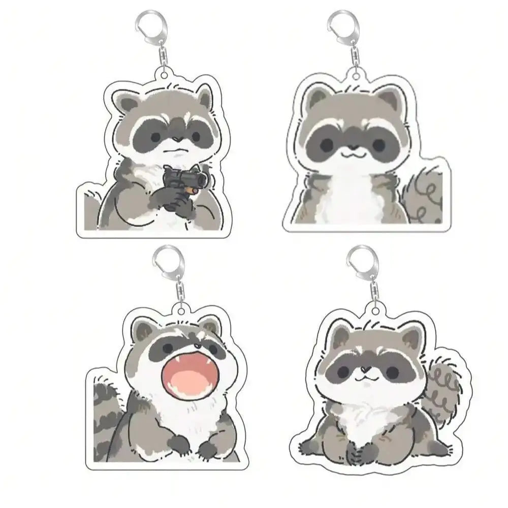 A set of four cute raccoon acrylic keychains featuring different facial expressions.