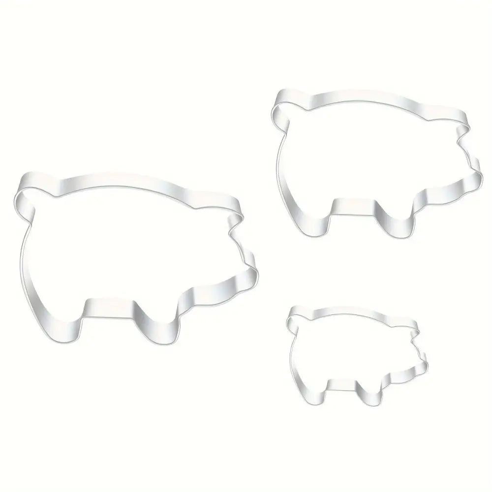 A set of three clear, pig-shaped stainless steel cookie cutters.