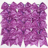 A pack of twelve purple glitter sequin pigtail bows for girls with elastic hair ties.