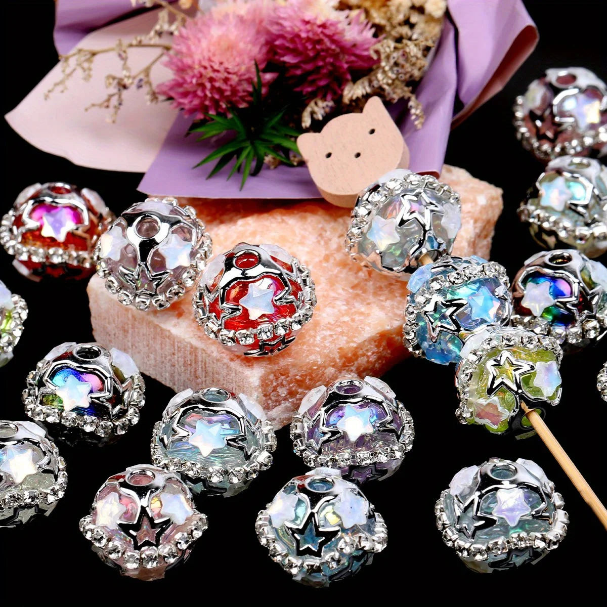A collection of silver star rhinestone acrylic beads and decorative elements for jewelry making