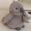 A soft gray cartoon bird plush with large eyes and a beak, designed as a keychain or pendant.