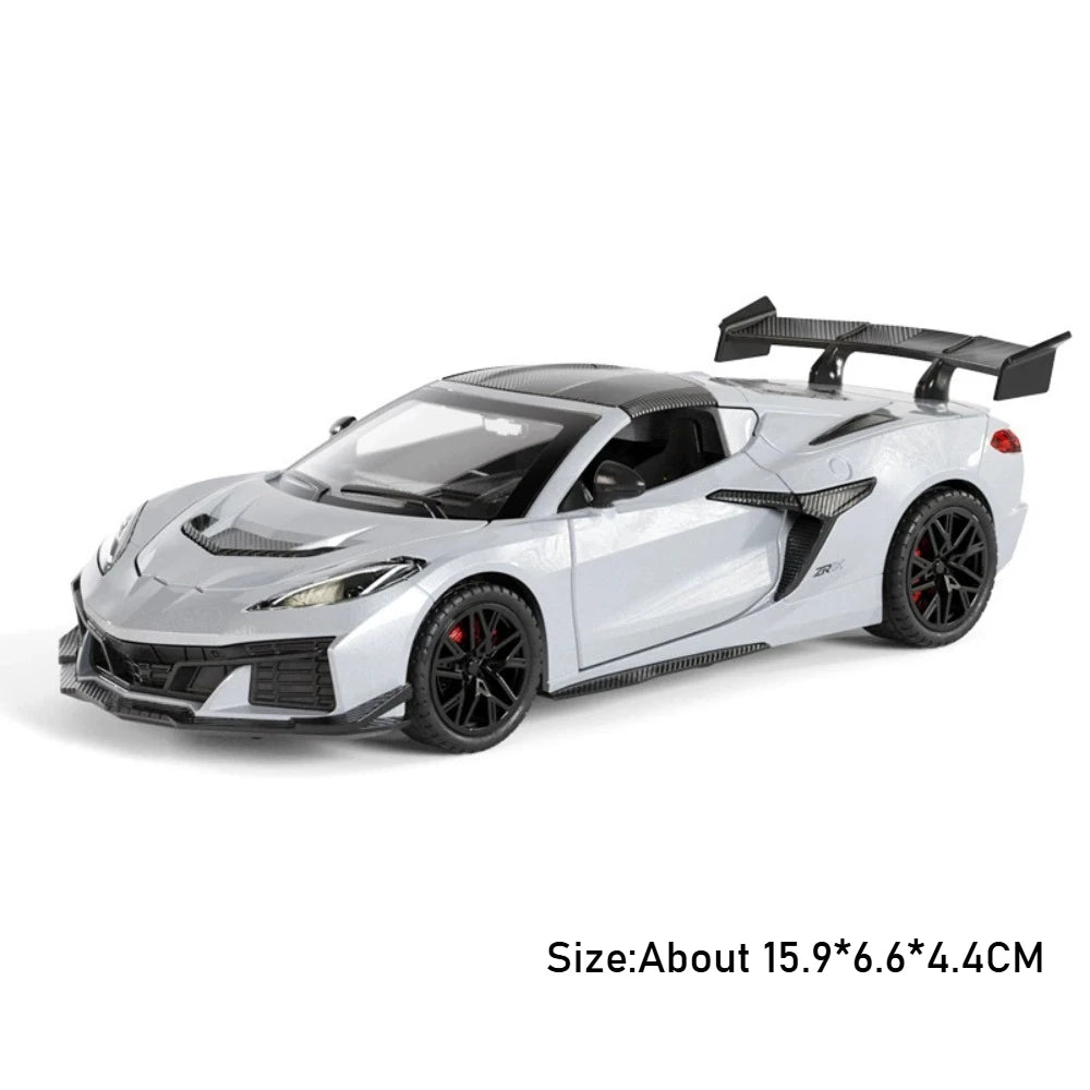 A silver 1:32 scale diecast supercar model with a black spoiler and pull-back action features is shown.