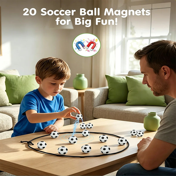 A boy and man play with a magnetic soccer ball game set on a wooden table.