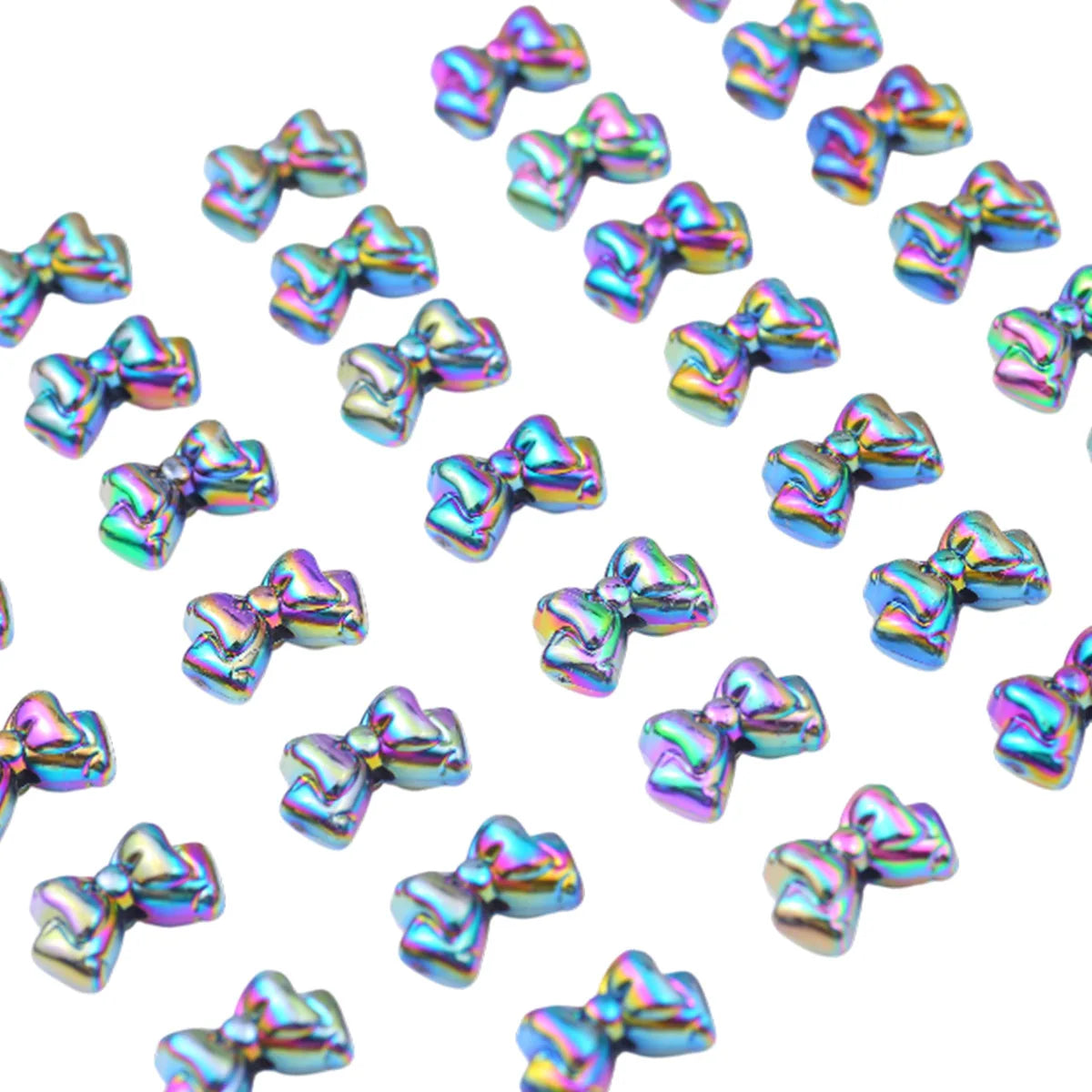 A collection of iridescent acrylic bow beads in various shades and sizes for jewelry making