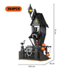 A dark gray haunted castle tree house building block set featuring a spooky Halloween theme with lights and decorative elemen