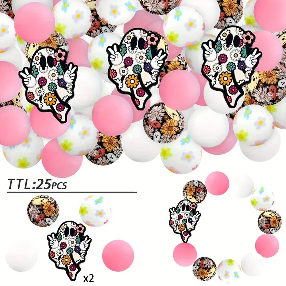 A collection of 25 silicone beads featuring Halloween-themed designs like ghosts and spiders in black and white.