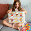 A smiling girl holds a colorful DIY pizza sticker craft kit for kids with various food-themed stickers.