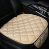 A beige quilted car seat cushion set with a matching cover resting on a black car seat.