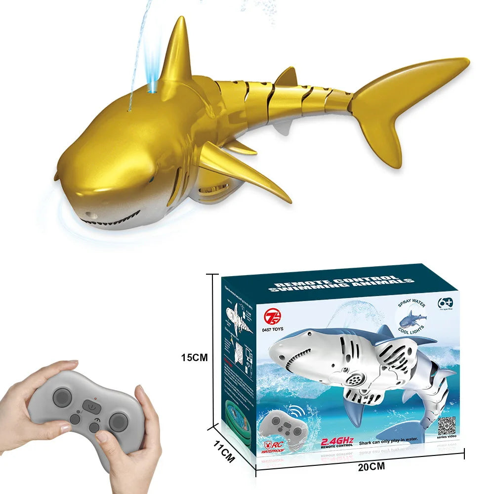 A golden shark toy is shown alongside a remote control and water spray bottle.
