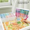 A collection of 30 diamond art storage trays and kits arranged in a white box on a colorful painting mat.