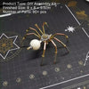 A finished steampunk metal spider assembly kit with multiple legs and a central mechanism displayed on a dark surface.