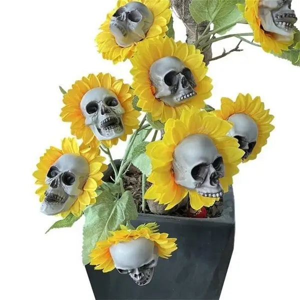 A plant decoration featuring yellow sunflower heads shaped like skulls.
