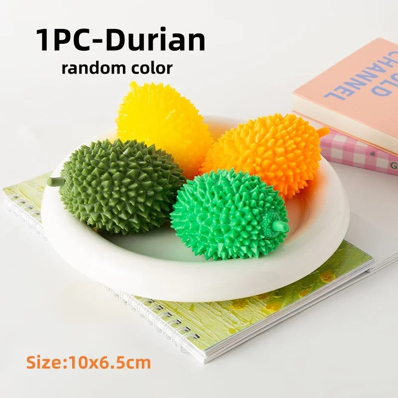 One piece Durian random color fruit squishy stress relief fidget toy in various shades of yellow and green