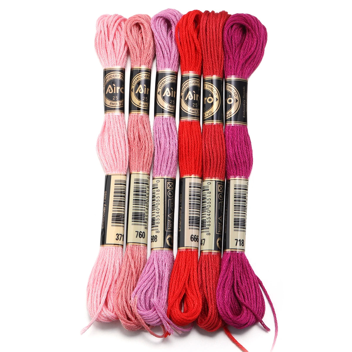 A set of six vibrant embroidery threads in various shades of pink, purple, and red for cross stitch and DIY crafts