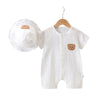 White cotton muslin baby romper and hat set with a teddy bear detail