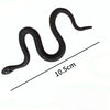 A black rubber snake prop is shown coiled and curved, with a scale indicating its length of 10.5 cm.